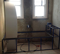Walls are rendered and bath is framed