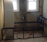 Walls are rendered and bath is framed