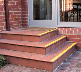 Stairs with tiles before removal