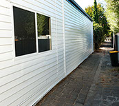Repainted weatherboard wall